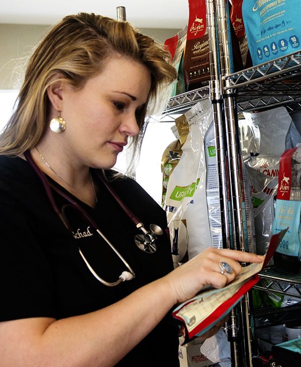 veterinarian reviewing nutritional information of a product